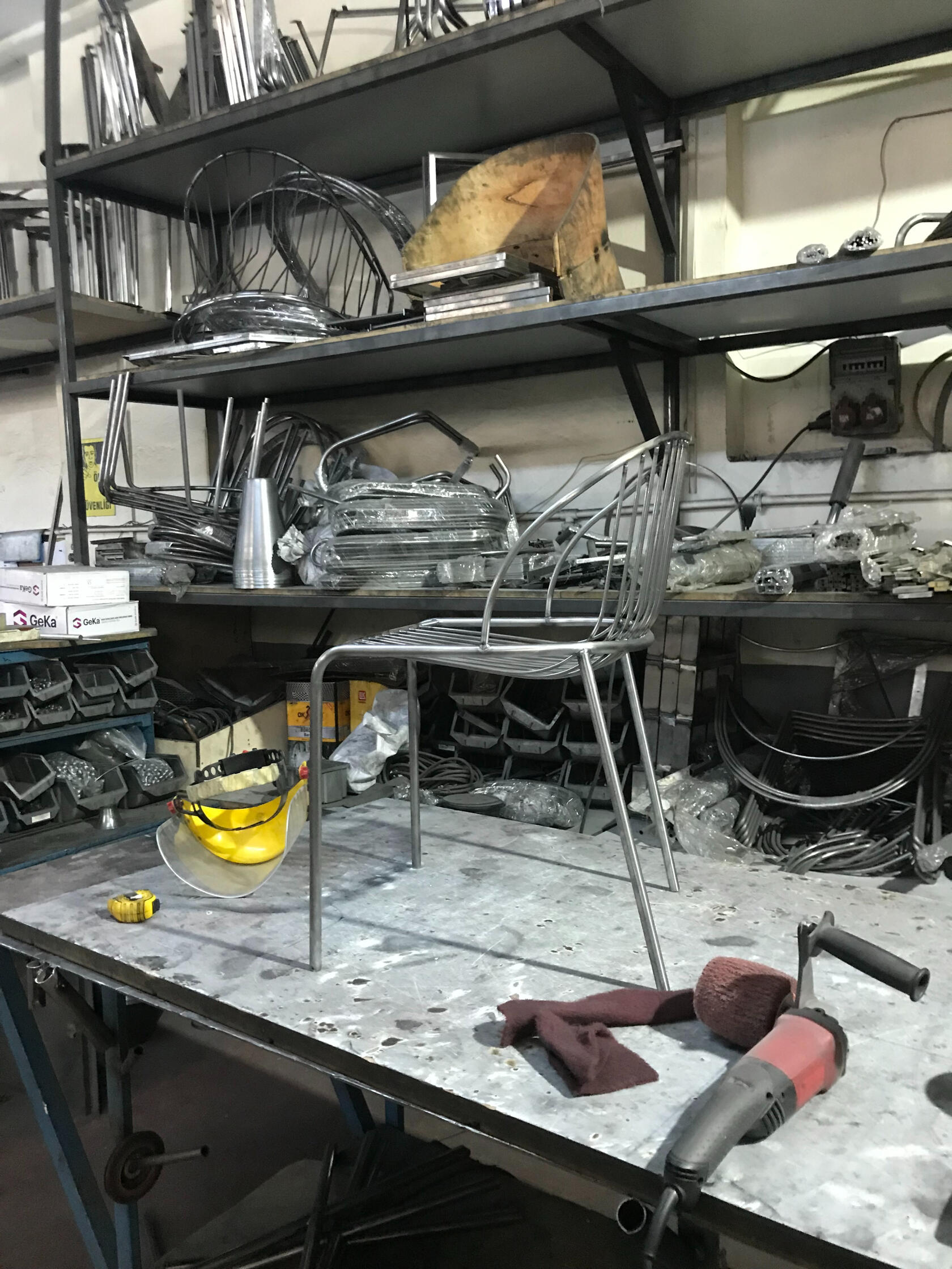 Metal chair on Work Bench