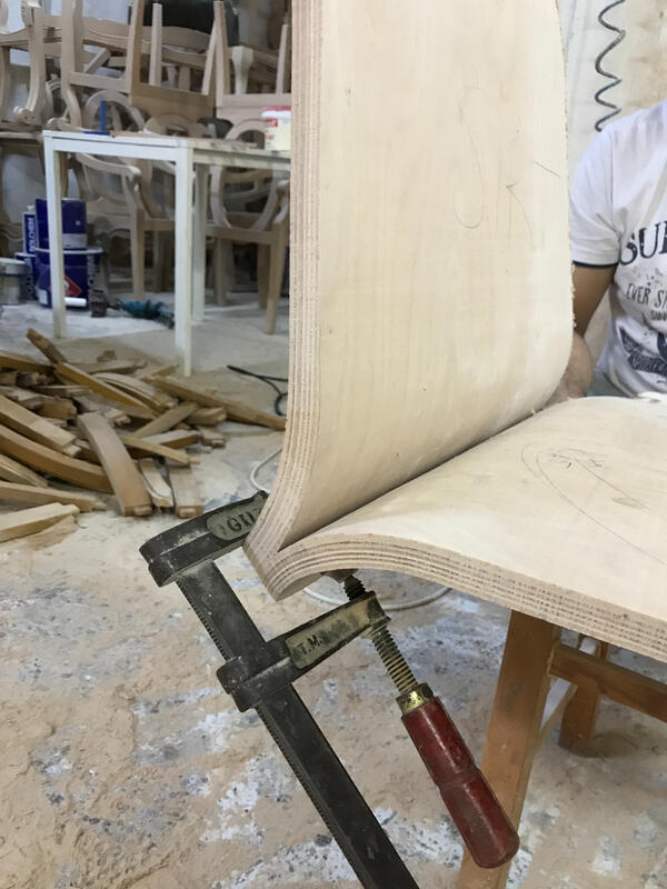 Bent ply chair pieces being joined