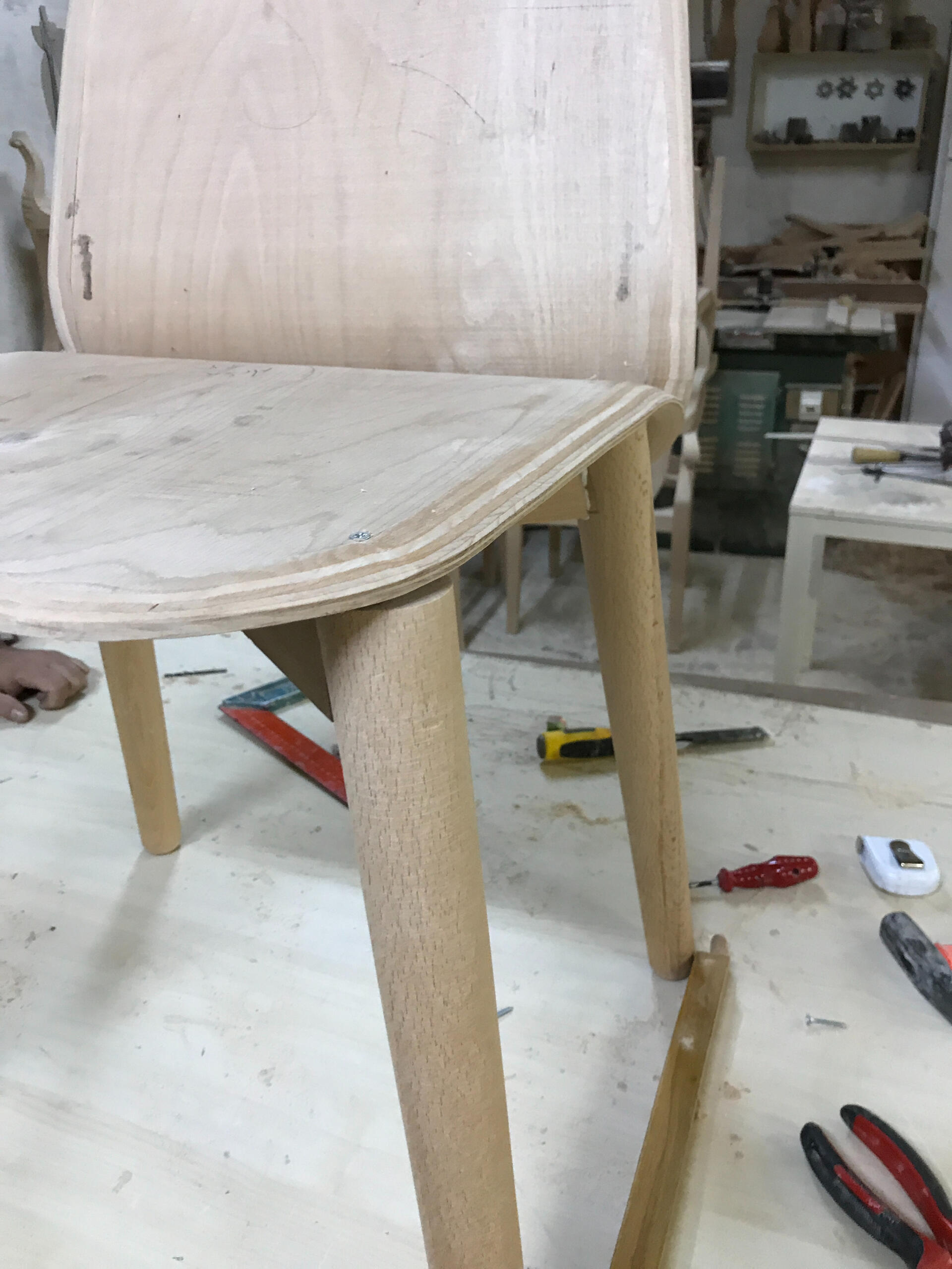 Bent ply chair corner radius is being formed